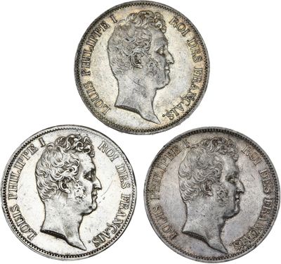 trois pièces d'argent britanniques, dont l'une est un souverain et l'autre est un souverain