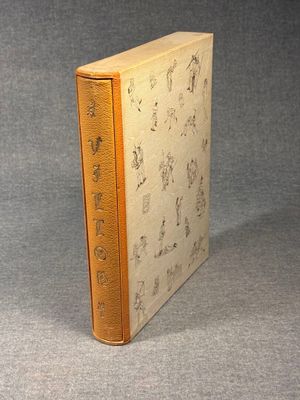 an old book sitting on top of a table covered in writing