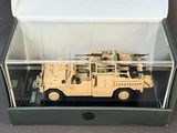 a box with a toy army vehicle inside of it