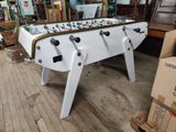 a foosball table in the middle of a room