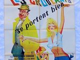 french movie poster for le choulants, with a man and a woman holding a sign