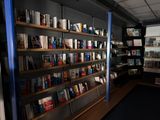 many books on the shelves in the room