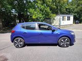 a picture of a blue car parked in a parking lot