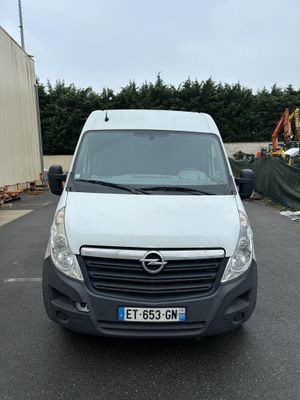 a white van that is parked in a parking lot