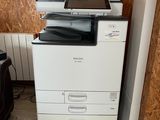 a printer that is sitting on top of a cabinet