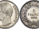 Gros plan sur une pièce de monnaie portant le visage d'un homme