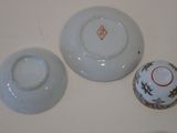two bowls and a bowl sitting on a table