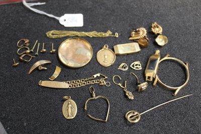 a lot of gold jewelry on a black surface