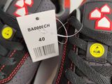 a close up of a pair of shoes with a price tag