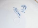 a white plate with a blue and white design on it