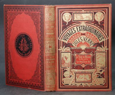 un vieux livre à la couverture rouge et aux lettres dorées