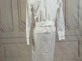 an image of a white dress on a mannequin stand