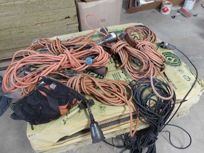 a pile of wires and other electrical equipment on a pallet