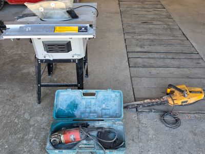 a tool box with tools on the floor in a garage