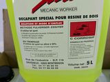 a yellow container filled with liquid sitting on top of a cardboard box