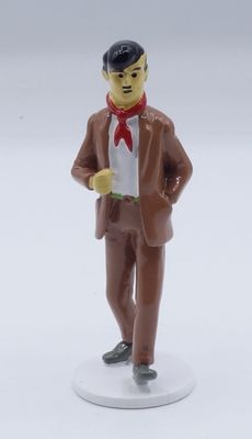 a figurine of a man in a suit and tie