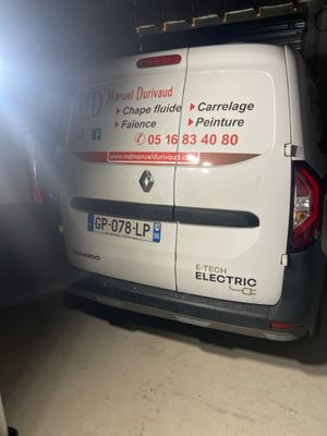 a van that is parked in a garage with its door open