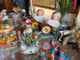 a glass table with a lot of figurines on it