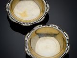 pair of gold and diamond - encrusted bowls