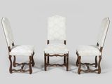 a set of four chairs with white upholstered upholstered upholstered upholstered upholstered upholstered upholstered