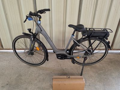 a bike that is parked next to a box