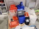 many bins of assorted items on the floor