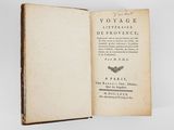 an open book with a picture of a butterfly on it