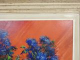 a painting of blue flowers in a vase on a table