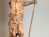 statue of a woman holding a spear and a dog