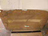 a cardboard box sitting on the floor next to a cardboard box