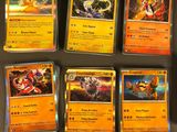 several pokemon cards are lined up on a table in a room