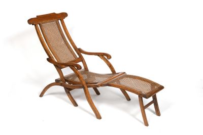 an image of a wooden lounge chair and footstool on a white background