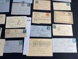 several old letters and envelopes on a table with a black background