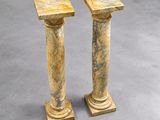 pair of marble pedestals in the style of a column