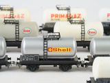 a lot of toy train cars that are lined up together