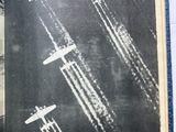 a book with a picture of airplanes flying in the sky
