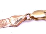 a close up of a gold zipper on a white background