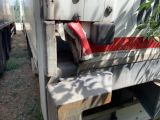 a close up of a truck with a red seat on it