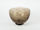 a glass bowl with a geometric design on it