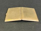 a small wooden book that is open on a table