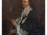 portrait of a man in a black coat and white collared shirt