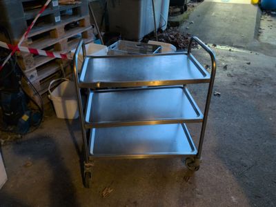 a metal cart that is sitting in a garage