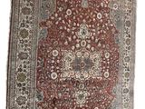 an antique persian rug with a medallion design on a white background