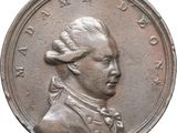 an old coin with a portrait of a man on it