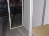 a box that is sitting in front of a glass door