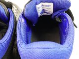 a close up view of a pair of shoes with blue laces