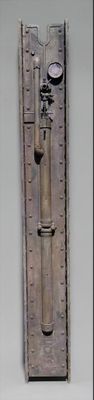 a picture of a metal object with a face on it