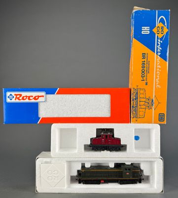 a toy train that is sitting next to a box