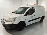 the white van is parked in a large room with white walls