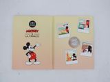 a close up of a book with pictures of mickey mouse on it